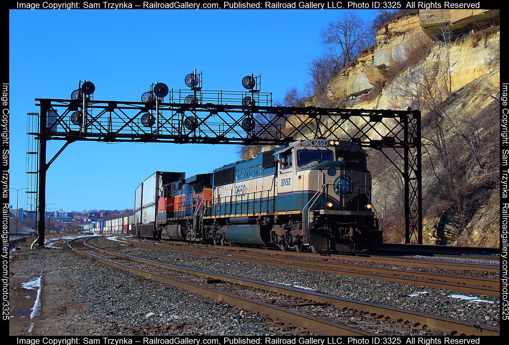 BNSF 9650 is a class EMD SD70MAC and  is pictured in St. Paul, Minnesota, USA.  This was taken along the BNSF St. Paul Subdivision on the BNSF Railway. Photo Copyright: Sam Trzynka uploaded to Railroad Gallery on 04/25/2024. This photograph of BNSF 9650 was taken on Sunday, February 18, 2024. All Rights Reserved. 